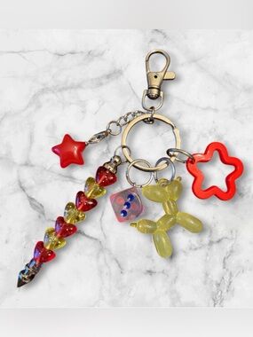 Playful Red & Yellow Charm Keyring with Balloon Dog and Star Accents